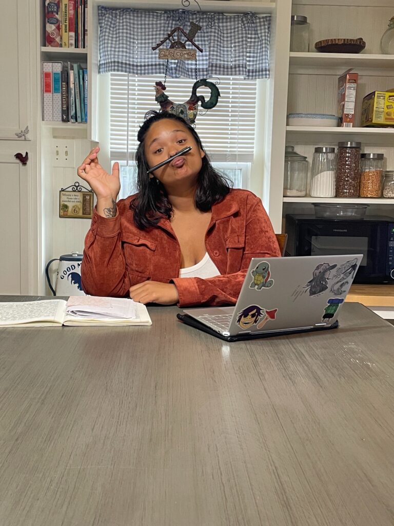 A photo of a website designer sitting at a dining table and acting silly. To show authenticity of showing the world your present business rather than what you aspire it to be. 